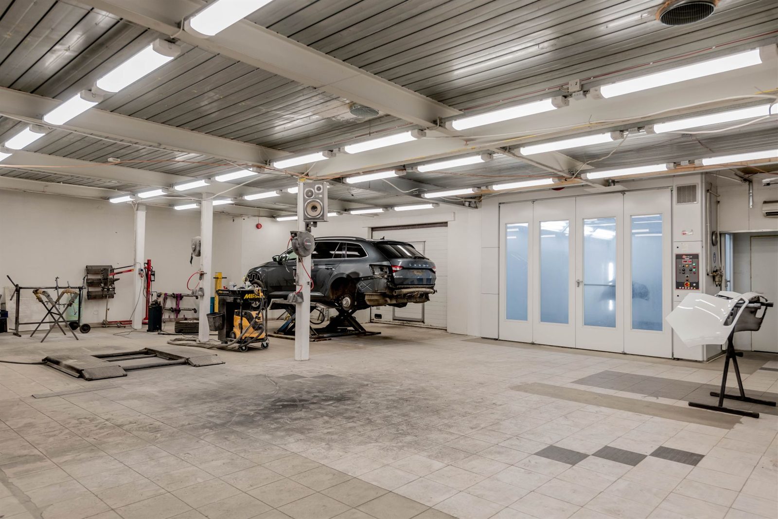 Car in a panel beating workshop repair bay